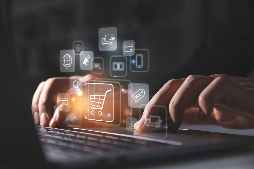 Young man using laptop with shopping cart icon, Online shopping and e-omnichannel concept.