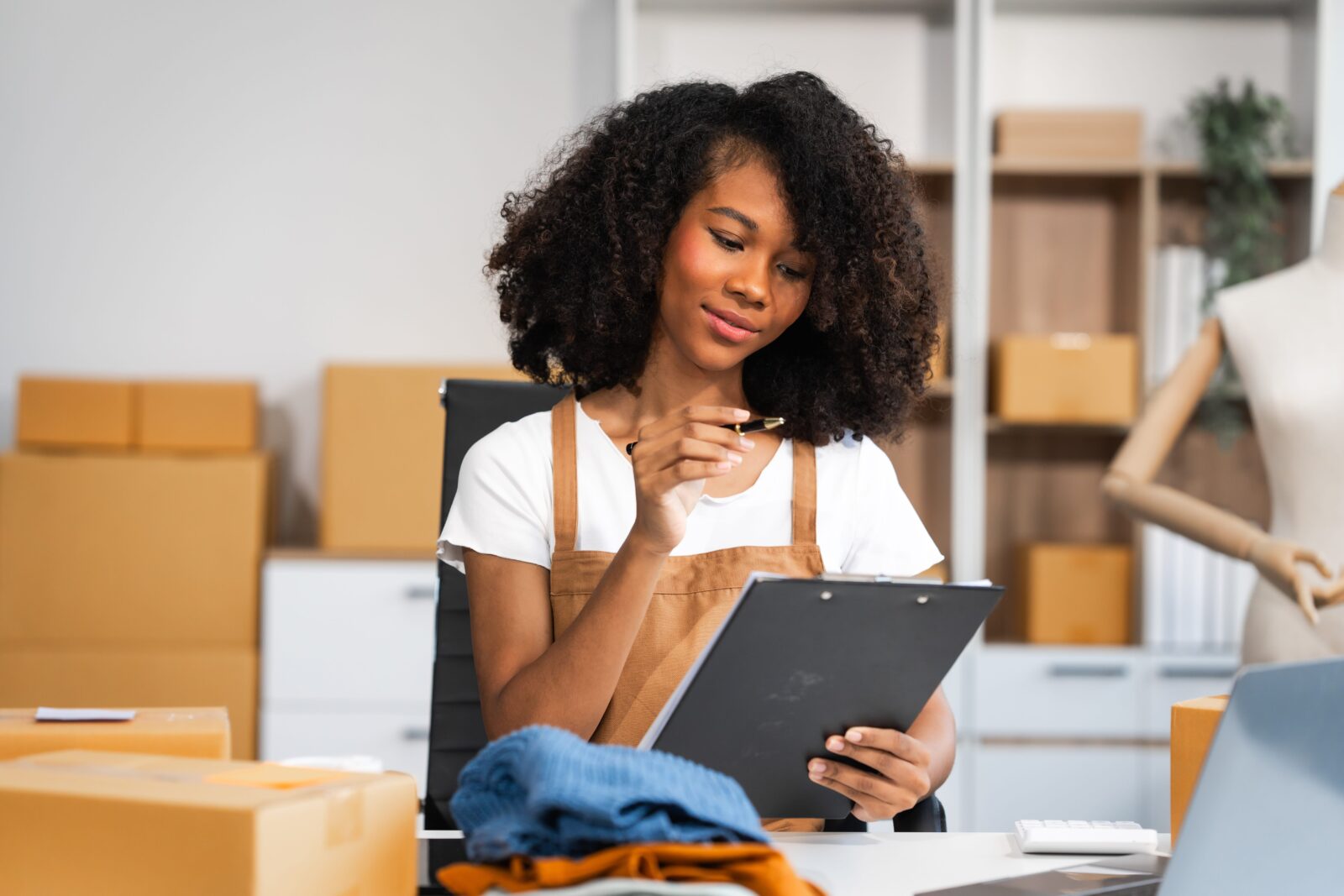 Young woman managing order for store.