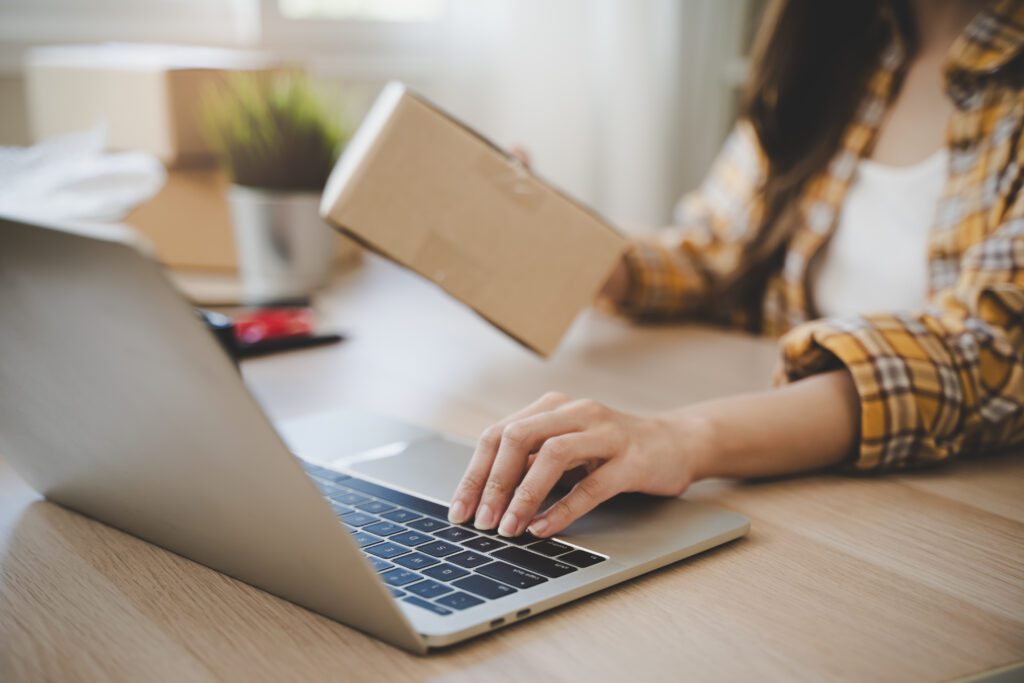 Person preparing packages for seamless shipping