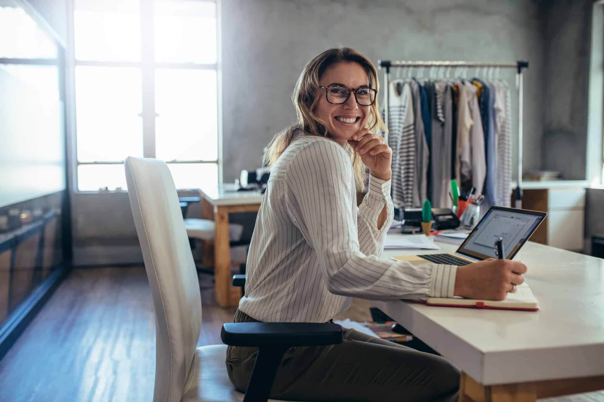 woman smiling working at desk