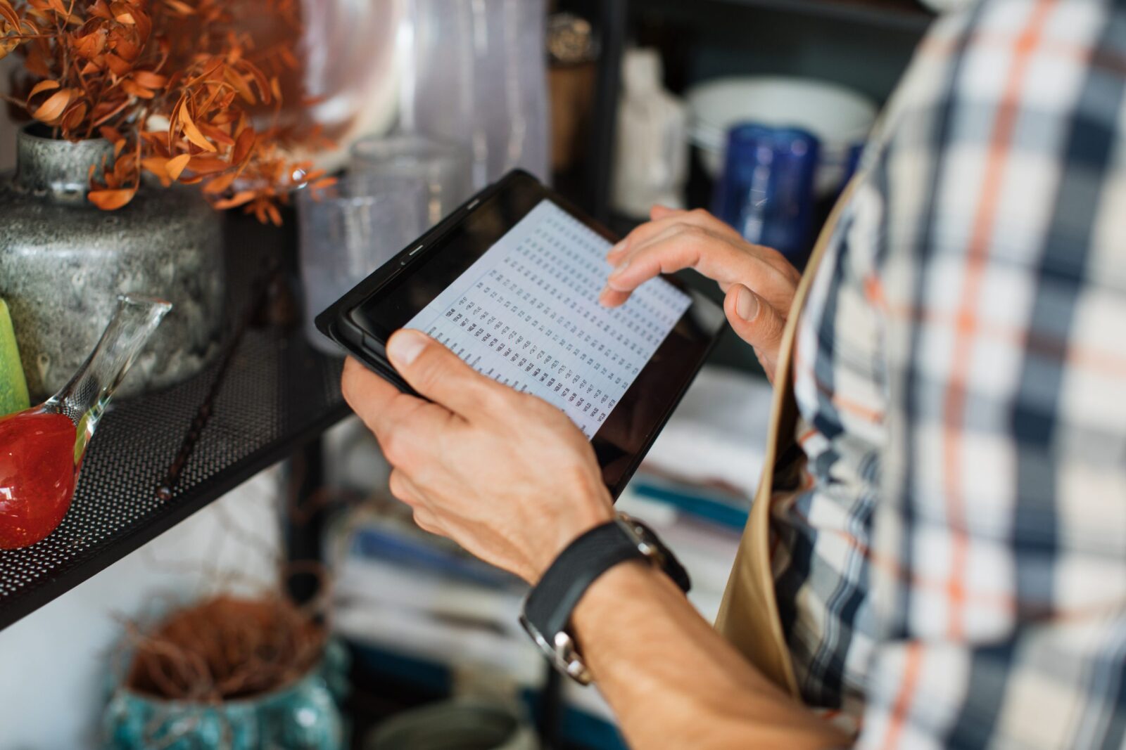 worker reviewing data on tablet