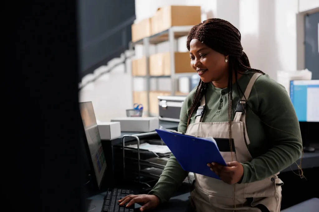woman processing B2B orders in a distribution center